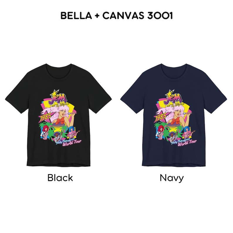 May include: Two short-sleeve crew neck t-shirts, one black and one navy, featuring a graphic print of Jem and the Holograms with the text BELLA + CANVAS 3001, 1985, and Truly Outrageous World Tour. The design includes a pink-haired character.