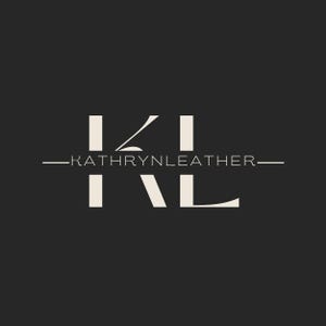 May include: A logo design featuring the letters "KL" in a stylized, off-white font against a dark gray background. The text "KATHRYNLEATHER" is centered below the letters, also in off-white, with horizontal lines extending from each side.