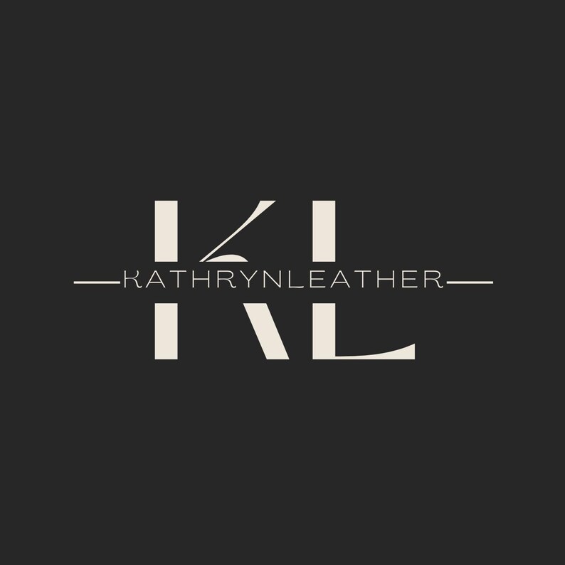 May include: A logo design featuring the letters "KL" in a stylized, off-white font against a dark gray background. The text "KATHRYNLEATHER" is centered below the letters, also in off-white, with horizontal lines extending from each side.