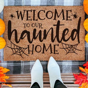 Welcome to Our Haunted Home Doormat | Haunted House Decor | Halloween Doormat | Spooky Door Mat | Spooky Housewarming Gift | Fall Door Mat