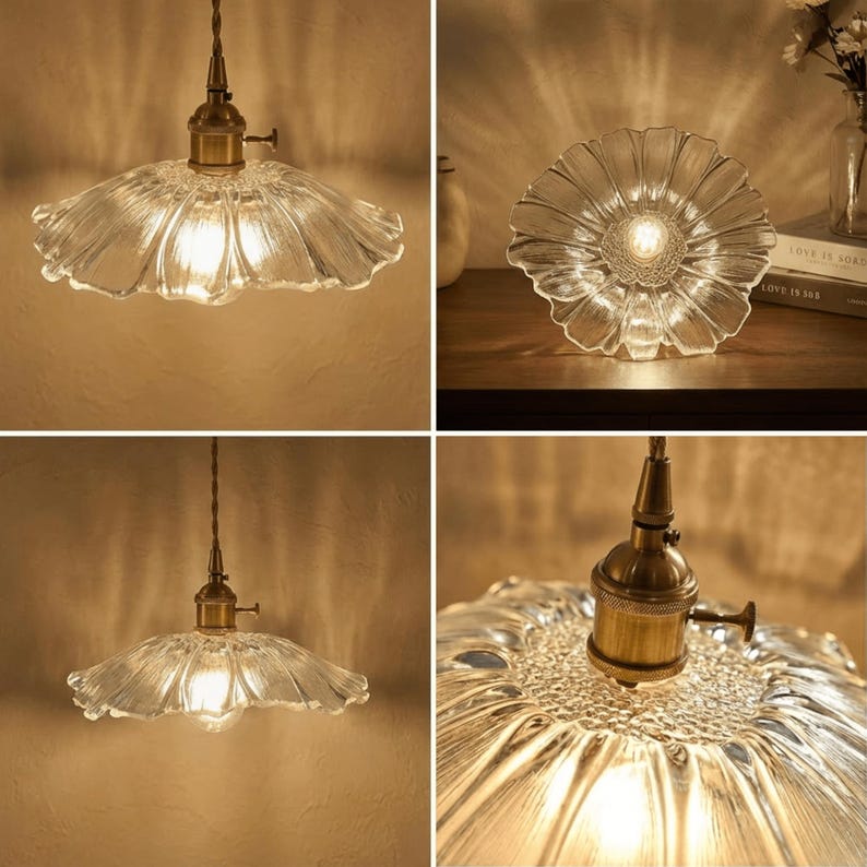May include: Clear glass pendant light with a flower-shaped shade and brass hardware. The light fixture is suspended from a brown cord and emits a warm glow. The shade has a textured, rippled design.