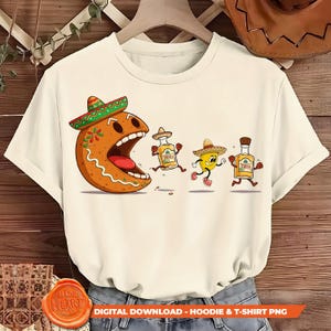 May include: Off-white t-shirt featuring a cartoon gingerbread man wearing a sombrero, chasing animated tequila bottles and a yellow chili pepper. The design includes the text "DIGITAL DOWNLOAD - HOODIE & T-SHIRT PNG".