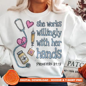 May include: White sweatshirt with a medical-themed design. The design includes a stethoscope, hearts, a syringe, and a pill bottle. Text reads "She works willingly with her hands" and "Proverbs 31:13".