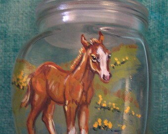 Foal on lidded glass container
