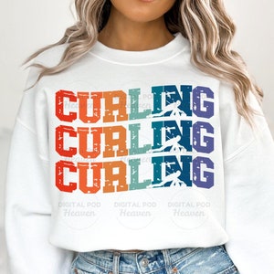 May include: White sweatshirt featuring the word "CURLING" in a retro design. The word is stacked three times in red, orange, and teal. Each word has a curling athlete graphic.