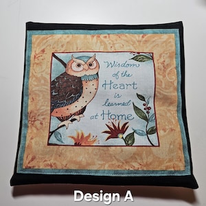 May include: Square decorative pillow with an owl illustration and the text "Wisdom of the Heart is learned at Home." The pillow has a black border, a teal inner border, and a floral pattern.