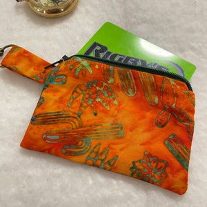 Handmade, Bright Orange and Rainbow Cactus Batik fabric zippered coin purse. Card Holder/Wallet with a lobster clasp.