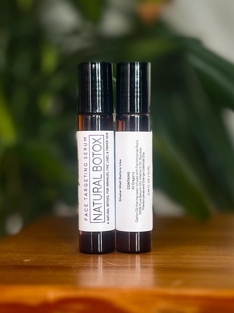 May include: Two brown glass bottles with black roll-on tops. The bottles are labeled "FACE TARGETING SERUM NATURAL BOTOX" and list the ingredients as "All Organic".
