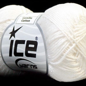 May include: A ball of white yarn with a label that reads "ICE YARNS" and "Camilla Cotton". The yarn is tightly wound and appears soft. The background is black.