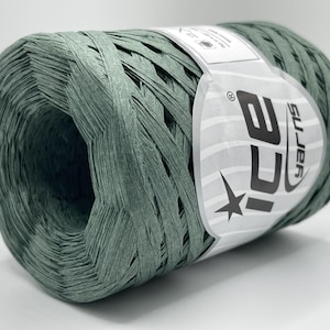 May include: A spool of sage green raffia yarn. The yarn is tightly wound and has a woven texture. A white label with the text "ICE yarns" and a star is wrapped around the spool.