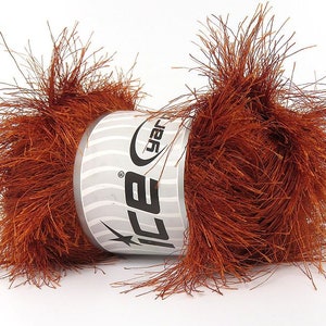 May include: A skein of brown fuzzy yarn with a white label that says "Ice Yarns" on it.