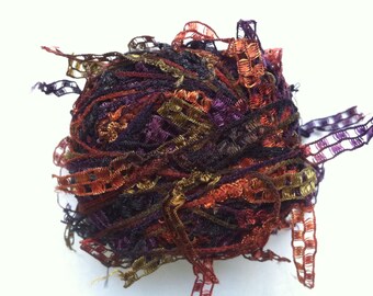 Trendsetter Cubetti #984 Tapestry - Ribbon Yarn Flags Carryalong in Purple, Olive, Copper, Black 25 grams 75 yards