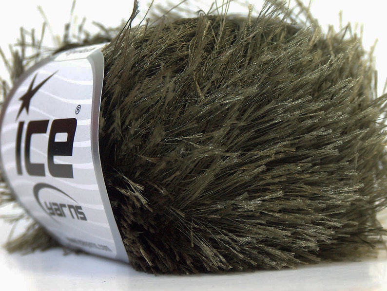 May include: A skein of dark green fuzzy yarn with the text "Ice Yarns" on the label.