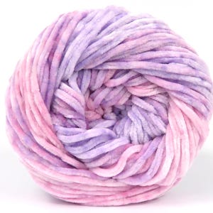 May include: A ball of soft, plush yarn in shades of pink and purple. The yarn has a velvety texture and is tightly wound, showing the layers of color. Ideal for knitting or crocheting projects.