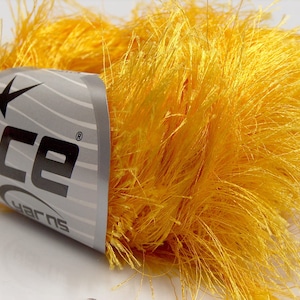 May include: A skein of bright yellow fluffy yarn with a label that reads "Ice Yarns".