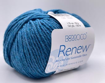 May include: A ball of blue yarn with a label that reads "BERROCO Renew". The label also states the yarn is made of recycled and sustainable fibers. The ball of yarn weighs 1.75 oz (50 g) and has 164 yds (150 m) of yarn.