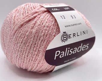 May include: A ball of pink Berlini Palisades yarn. The yarn has a textured appearance and a label with the brand name, product details, and the text "Made in Italy". The label also includes the text "COL. 12 93" and the website address.