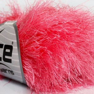 May include: A skein of pink fluffy yarn with the label "Ice Yarns" on it.