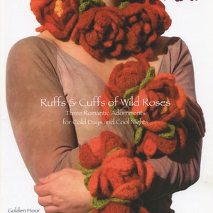 May include: A crochet pattern for three knitted rose adornments, including a ruff and two cuffs. The pattern is called "Ruffs & Cuffs of Wild Roses" and is by Laura J. Bellows. The pattern is for sale for $8.00.