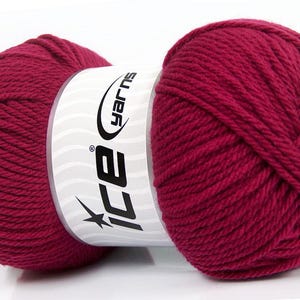 May include: A close-up of a skein of burgundy yarn. The yarn is wrapped around a white label with the text "ice yarns" in black. A star graphic is also on the label. The yarn is thick and appears soft, suitable for knitting or crocheting projects.