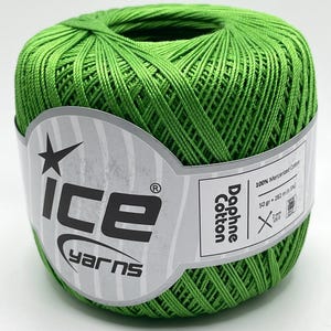 May include: A ball of bright green mercerized cotton yarn. The label reads "ice yarns" and "Daphne Cotton". The ball of yarn is 50 grams and 282 meters. The label also indicates the yarn is 100% mercerized cotton.