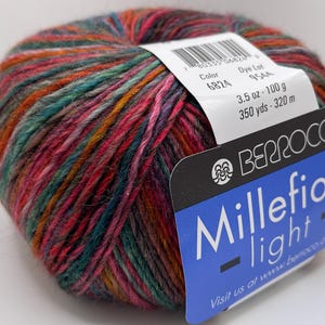 May include: A ball of Berroco Millefiori Light yarn in colour 6824. The yarn is a multi-coloured blend of pink, orange, green, and blue. The ball is 100 grams and contains 320 metres of yarn.