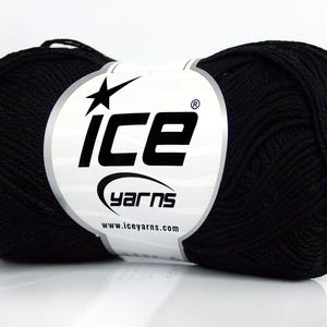 May include: A black yarn ball with a white label featuring the "ICE yarns" logo. The yarn is tightly wound, and the label includes the website address www.iceyarns.com. This yarn is suitable for various knitting and crochet projects.