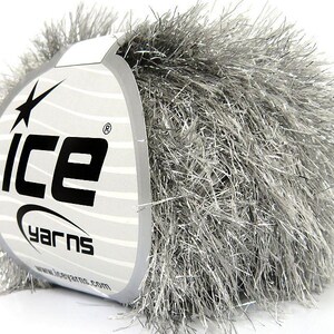 May include: A skein of silver sparkly yarn with a white label that says "Ice Yarns" and has a star logo.