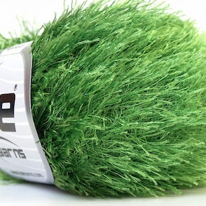 May include: A skein of bright green fuzzy yarn with a white label that says "Ice Yarns".