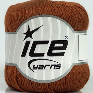 May include: A ball of brown yarn with a white label that says "ICE yarns" with a star logo.