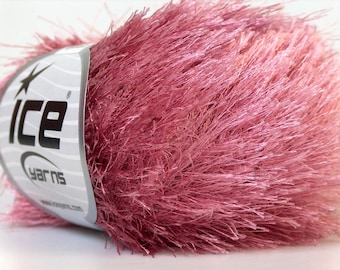 May include: A skein of pink fuzzy yarn with a white label that says "Ice Yarns".