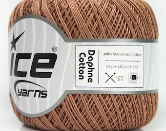 May include: A ball of brown Daphne Cotton yarn from Ice Yarns. The label indicates it is 100% mercerized cotton, 50 grams, and 282 meters. The yarn is a Super Fine weight, with a 2 mm needle size.