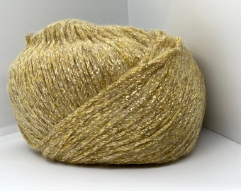 May include: A ball of gold yarn with a shimmery finish.