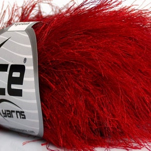 May include: A skein of red fuzzy yarn with a white label that says "Ice Yarns" with a star logo.