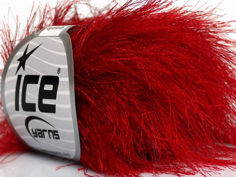 May include: A skein of red fuzzy yarn with a white label that says "Ice Yarns" with a star logo.