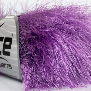 May include: Purple fuzzy yarn with a label that says "Ice Yarns".