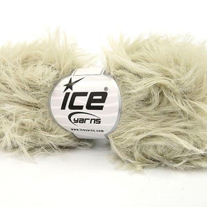 May include: A skein of light beige fluffy yarn with a white label that says "Ice Yarns" and "www.iceyarns.com".