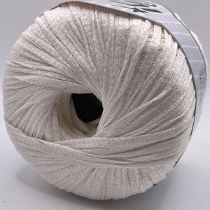May include: A skein of white yarn, wound into a ball shape. The yarn is made of a soft, silky material and has a subtle sheen.