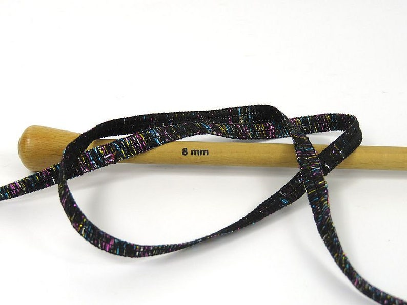 Namaste Glitz Ribbon Yarn 80354 Ice Yarns Black with Blue Pink Gold Silver Sparkle, Polyester 50 gr (1.76 oz) 57 m (62 yds) x 1/4 inch wide. image 3