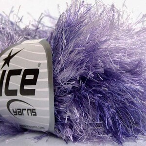 May include: A skein of purple and white fuzzy yarn with a label that reads "Ice Yarns".