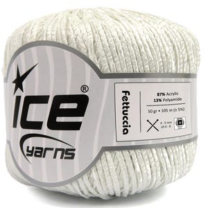 May include: A ball of white yarn called "Fettuccia" by Ice Yarns. The label states it is 87% acrylic and 13% polyamide, weighing 50 grams and measuring 105 metres. The recommended needle size is 4-5 mm (US 6-8).