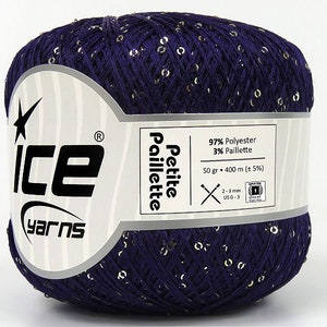 May include: A skein of purple yarn with gold sequins. The label reads "Ice Yarns Petite Paillette 97% Polyester 3% Paillette 50 g. 400 m (± 5%) 2-3 mm US0-3"