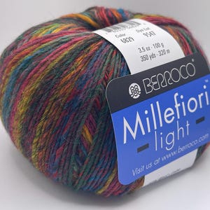 May include: A ball of multicoloured yarn with a label that reads "Berroco Millefiori -light- Visit us at www.berroco.com". The label also includes the colour number 6829, dye lot 9547, and the weight 3.5 oz - 100 g, 350 yds - 320 m.