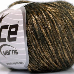 May include: A ball of dark green and gold yarn with a metallic sheen. The yarn is labeled "ICE yarns" with a star logo.