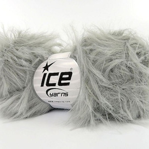 May include: A skein of gray fluffy yarn with a white label that says "Ice Yarns" and a star logo.