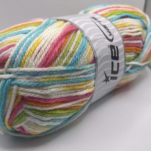 May include: A colorful ball of yarn with stripes of white, pink, blue, yellow, and green. The yarn is wrapped with a label that reads "ice". This yarn is suitable for knitting and crocheting projects.