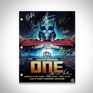May include: A Transformers One movie poster featuring a blue and red robot with a yellow chest and a black face. The robot is standing in front of a blue and purple background with a yellow and orange sky. The title "Transformers One" is written in yellow letters on a black background. The poster is signed by several people, including the director, Michael Bay.