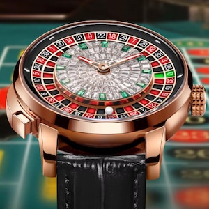May include: A gold-tone wristwatch with a black leather band. The watch face features a roulette wheel with numbers 1 through 36, 0, and 00. The roulette wheel is surrounded by a diamond-encrusted bezel.