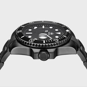 May include: A black stainless steel watch with a black dial and white markings. The watch has a rotating bezel with white numbers and a date window at the 3 o'clock position. The watch is on a black stainless steel bracelet.