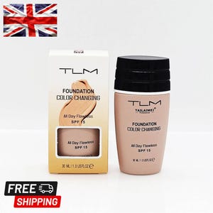 May include: A beige TLM Tailaimei foundation bottle and its matching rectangular cardboard box. Both items feature black text reading Foundation Color Changing, All Day Flawless, SPF 15, and 30 ml / 1.0 US fl oz. The bottle has a black screw-on cap.